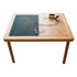 Wooden table with a chalkboard surface and geometric design on a white background