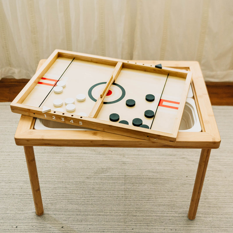 Wooden table top game with pieces on a neutral background