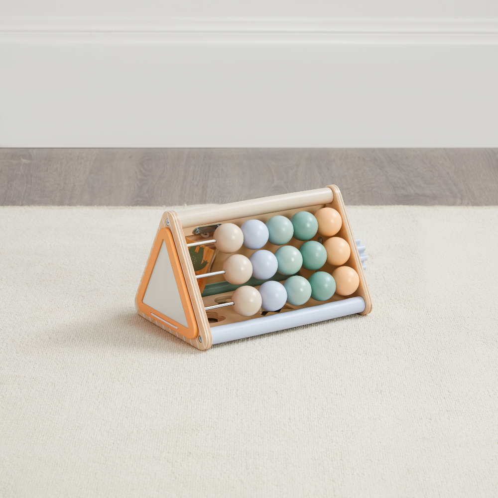 Wooden activity triangle with colorful beads and counting rods on beige carpet