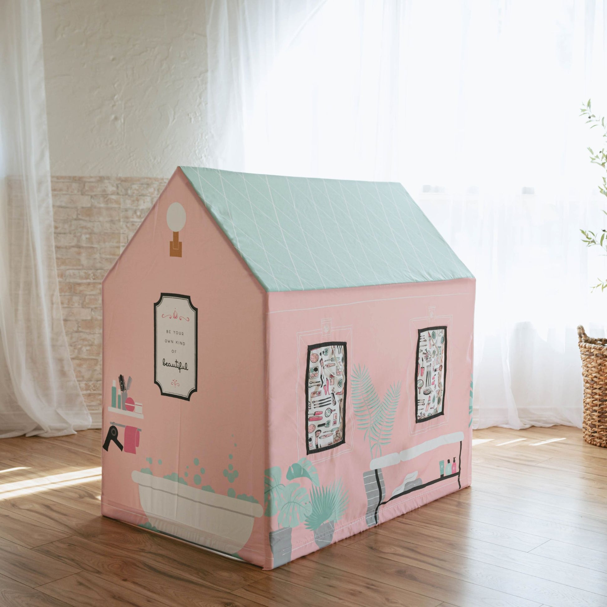 Pink kids play tent beauty salon with mint roof in bright room setting