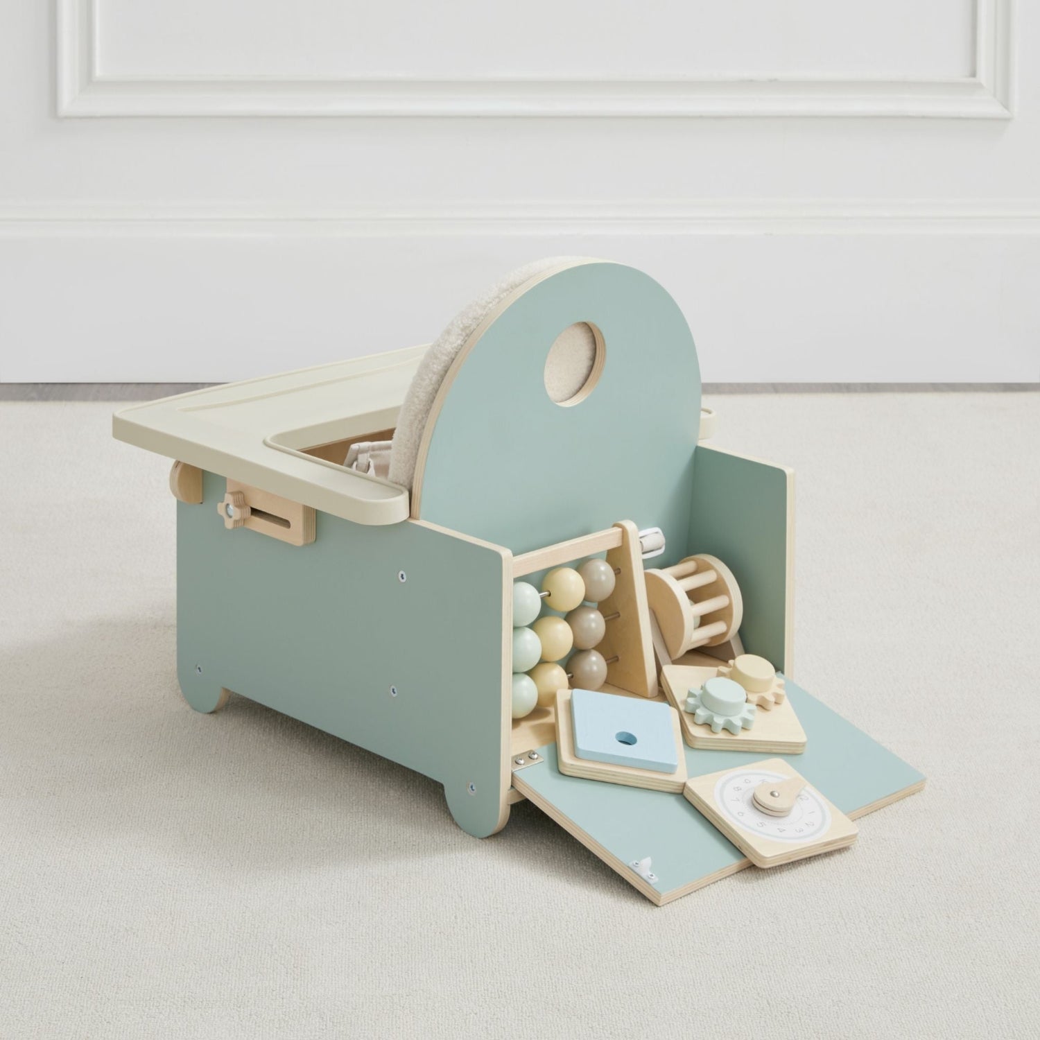 Wood frame includes convenient storage for the included toys in the back of the chair.