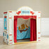 Children's play theater with red curtains and a ship design on a wooden floor.
