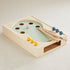 Cool Pool wooden tabletop pool game with sage green playfield, two cues and blue and yellow wooden balls on carpet