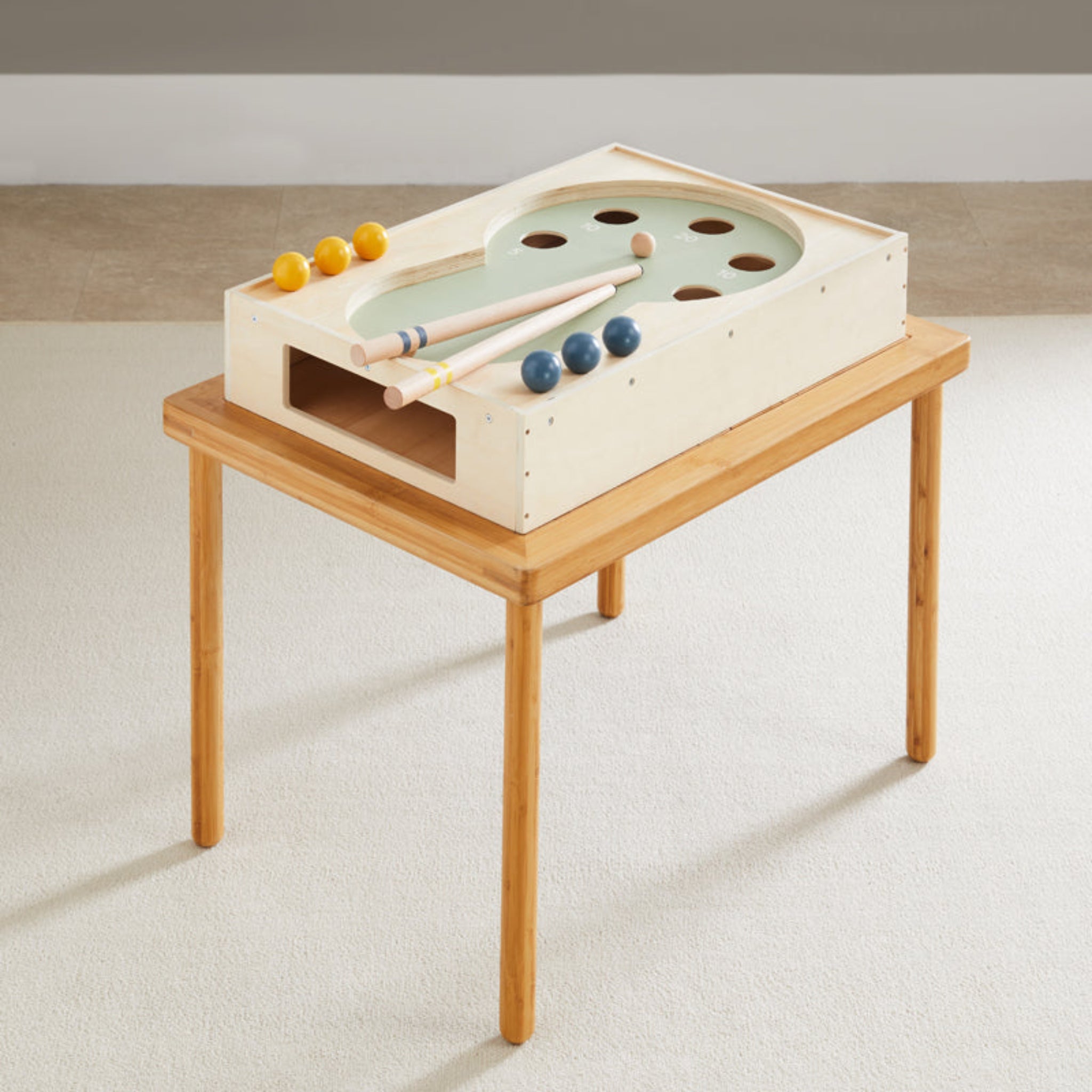 Cool Pool game set on top of the wooden Land, Sand and Water Table in a bright room
