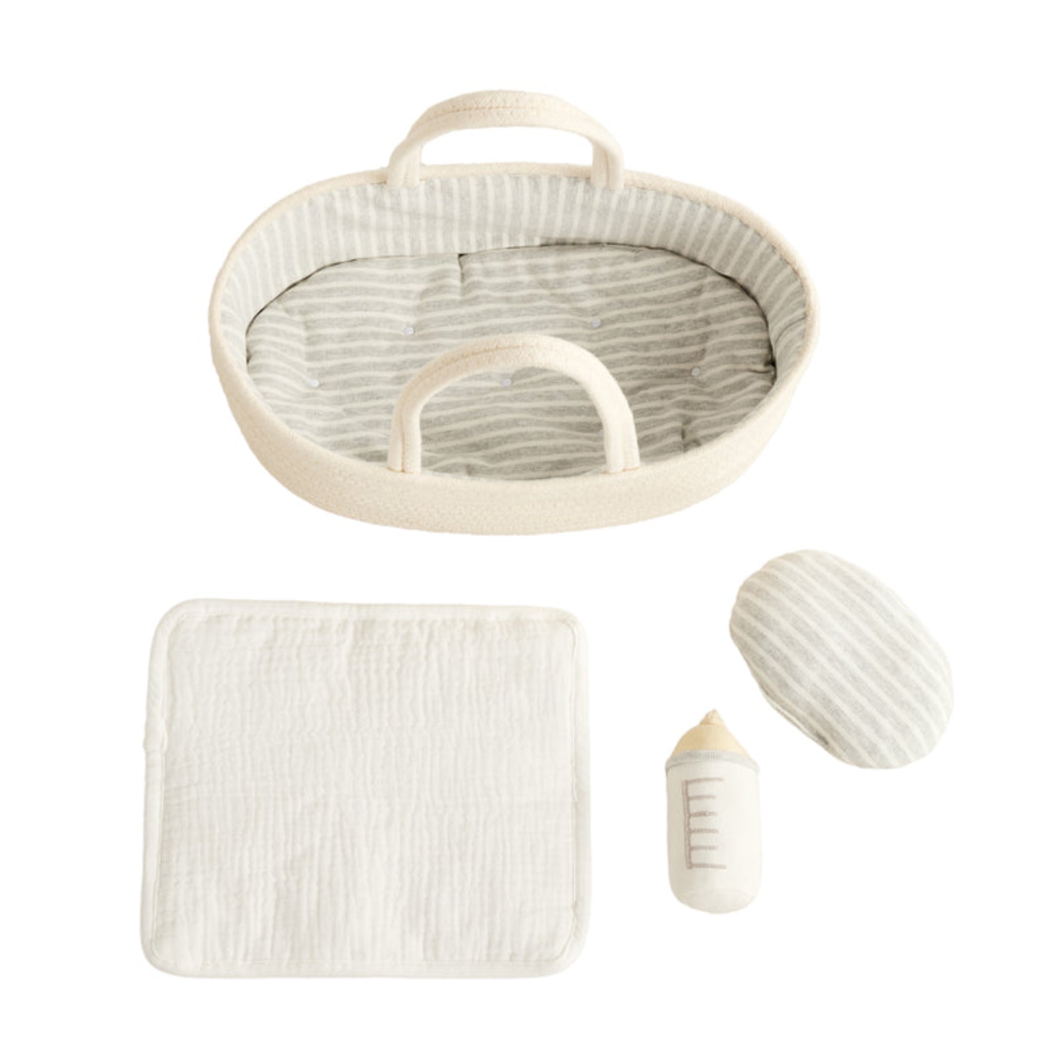Doll Carrier shown from above with the striped mattress and pillow, white muslin blanket and plush bottle laid out
