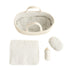 Doll Carrier shown from above with the striped mattress and pillow, white muslin blanket and plush bottle laid out