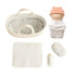 Doll Carrier and Bundle Baby Cookie set laid out: rope carrier, swaddled doll in peach cap, blanket, pillow, bottle