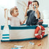 Two children in the Gone Fishing Boat, one holding the wooden oar and one casting a fishing rod