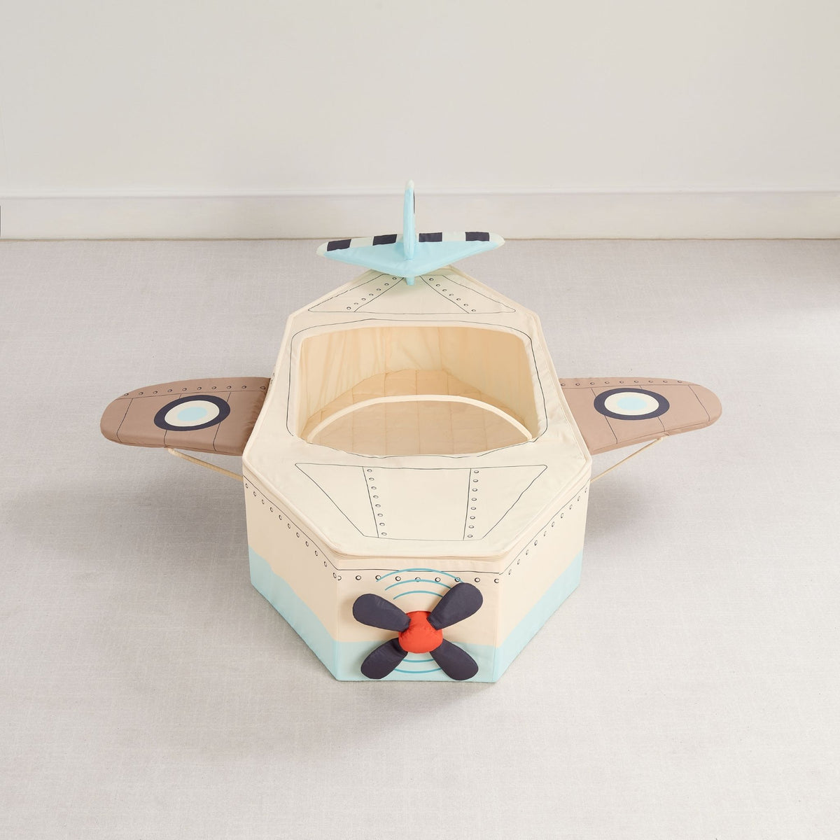 Gone Flying Airplane seen from the nose, showing the plush propeller, wings and tail fin.