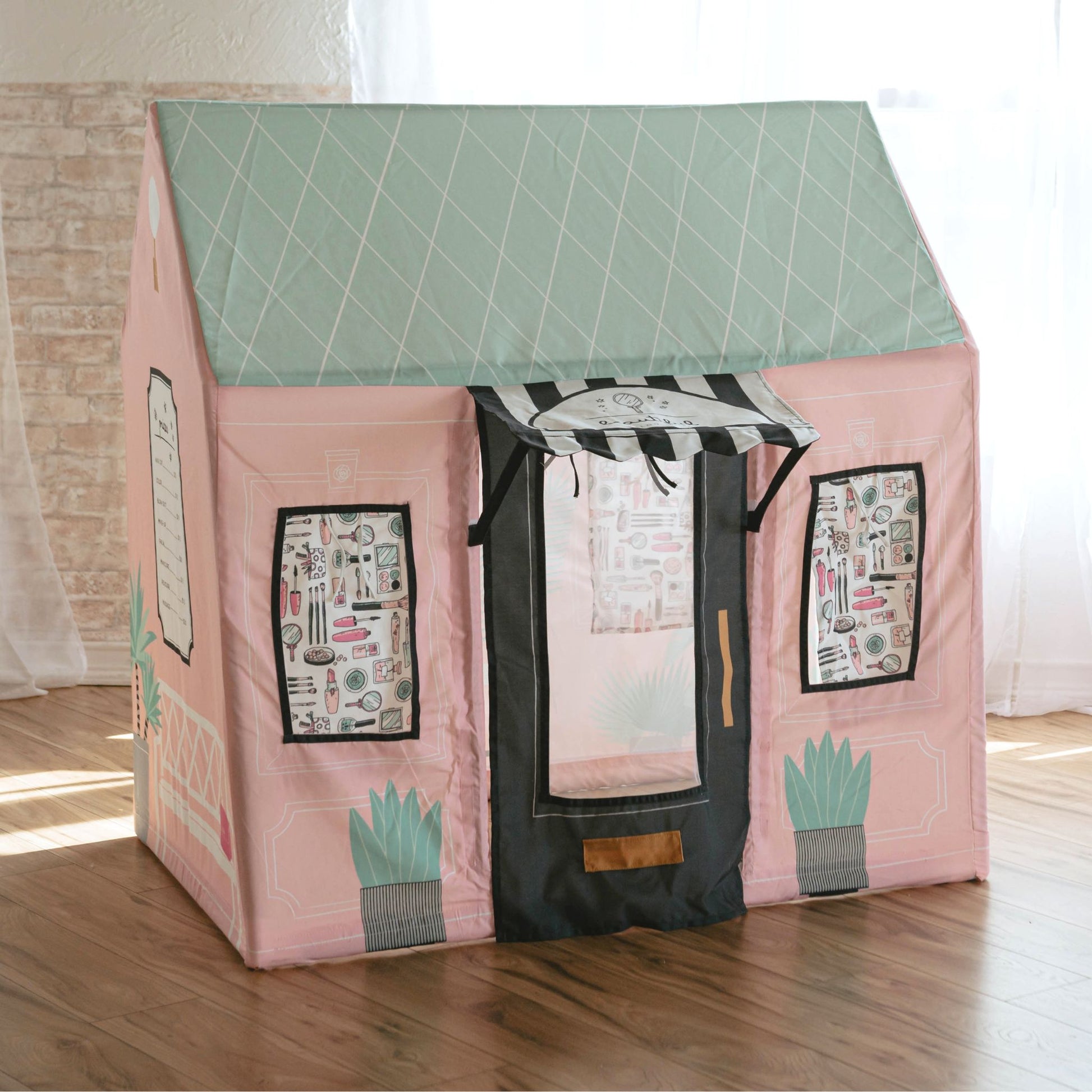 Kids play tent beauty salon with pink fabric, green roof, windows and black door