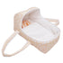 Beige and white polka dot baby doll carrier with handles and cream interior lining