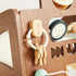 Close-up of the wooden key fob and keys on a ring attached to the Waldo Activity Walker panel