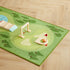 Play mat with wooden playset on a wooden floor