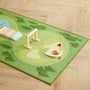 Play mat with wooden playset on a wooden floor