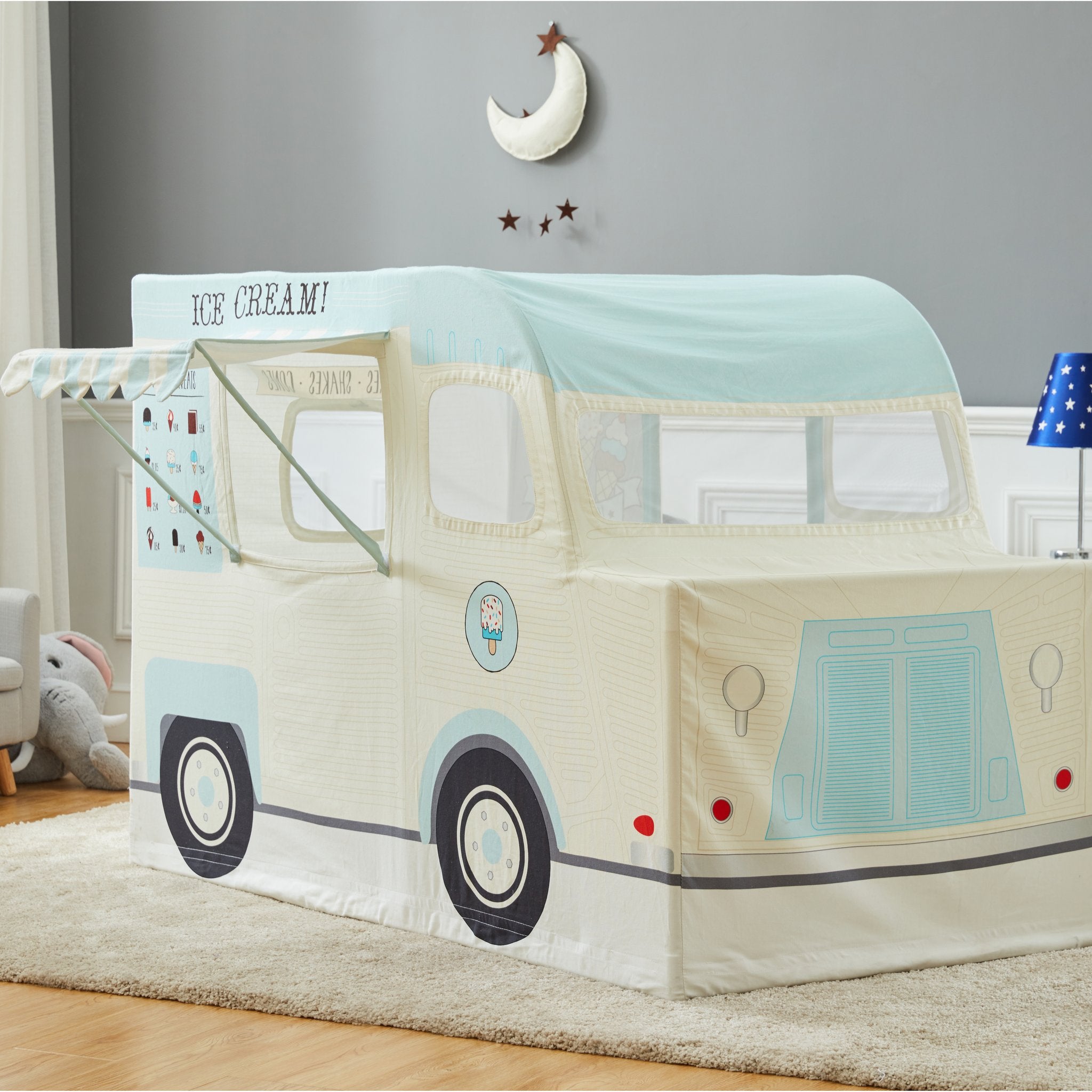 Ice Cream Truck Playhome in cream and mint with striped awning, menu board and mesh windows, in a bedroom