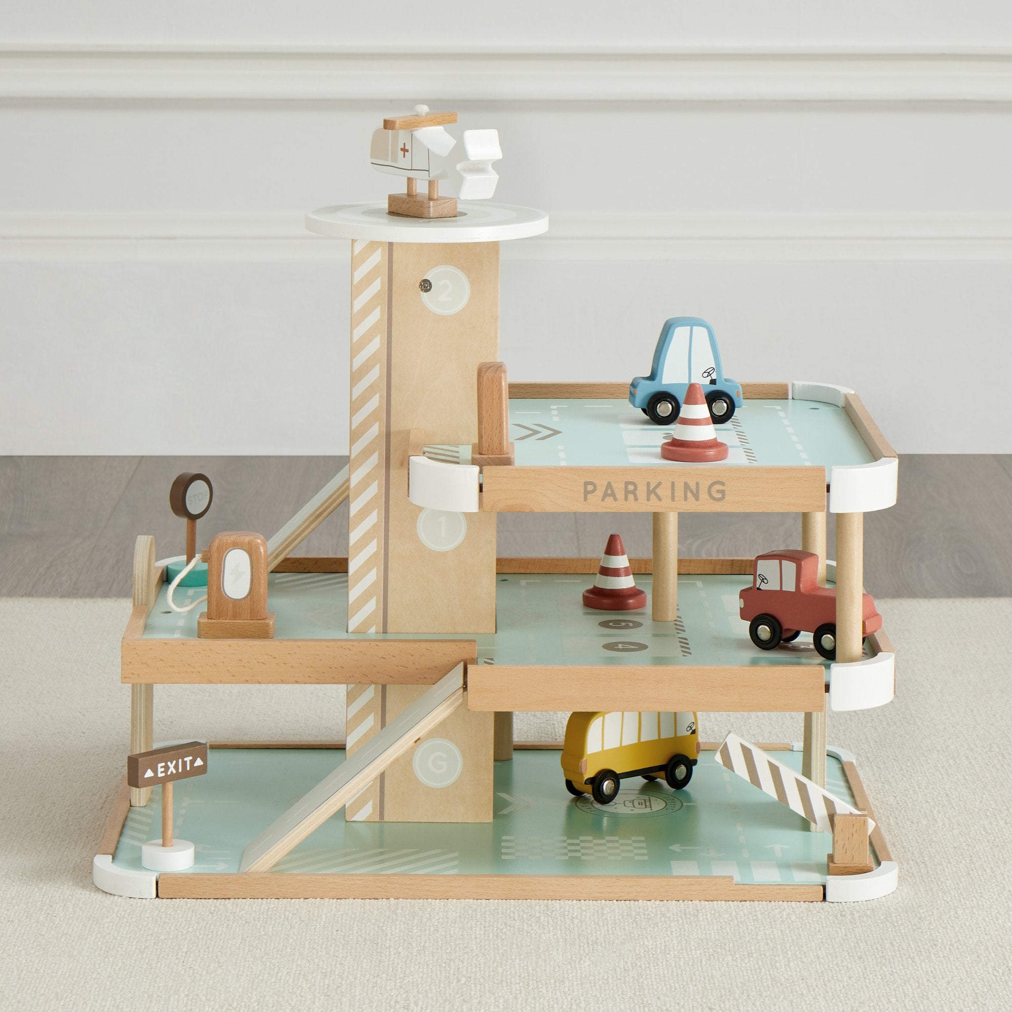Little Tot Parking Lot garage in mint and natural wood with four vehicles parked on its levels