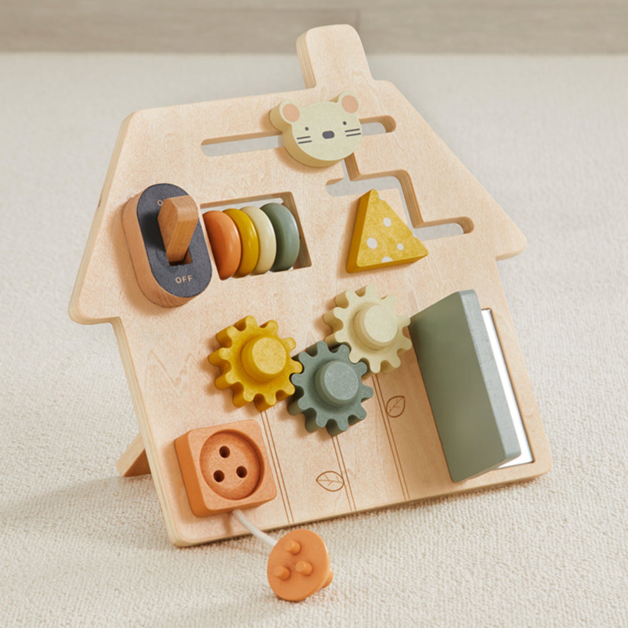 Wooden house-shaped travel busy board with gears, switch, and other interactive elements