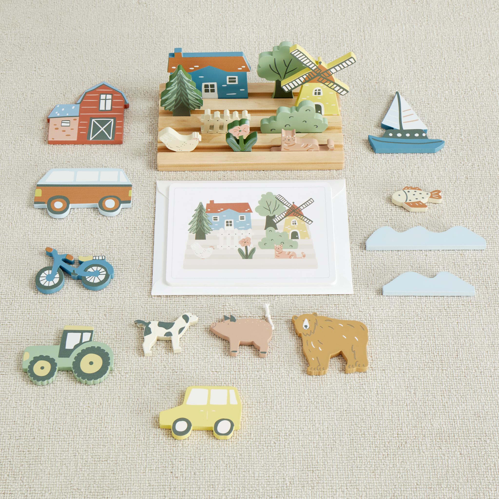 My Town Picture Matching Game pieces laid out on carpet around a farm scene card, with a windmill, barn, animals and van